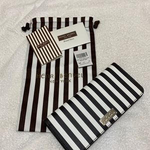 Henri Bendel stripped W 57th Single Snap Wallet. Stripped leather
